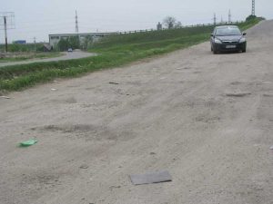 După ploaie, gropile au reapărut